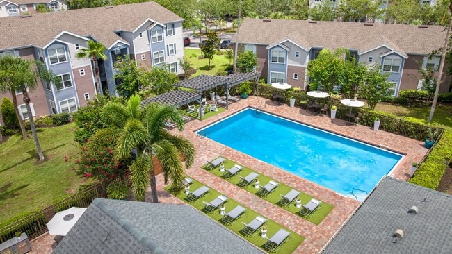 Enjoy every sunny Florida day from our sparkling pool, complete with lounge seating and a relaxing atmosphere. - Ashton Chase