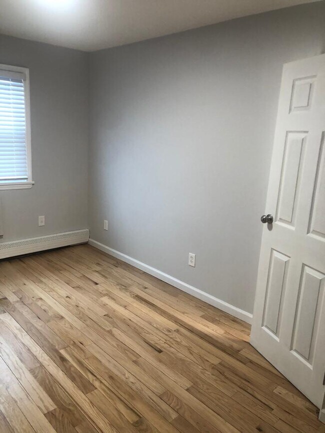 Master bedroom featuring his and her double closets and oak hardwood floors. Large enough to fit a king-size bed. - 2027 Linden Blvd