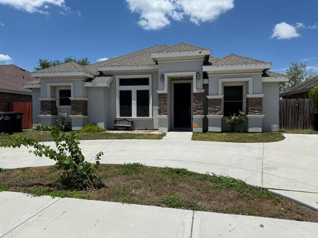 Building Photo - 1321 W Combes Ave