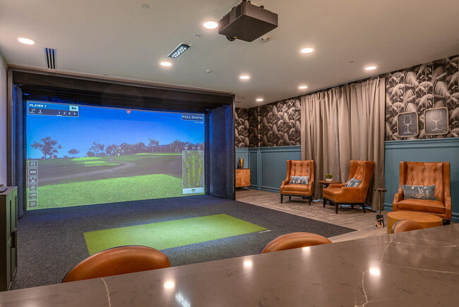 Recreation room with golf simulator and dry bar. - LIVIA at Scripps Ranch