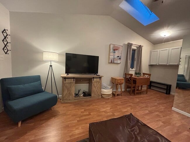 Living room/dining room with vaulted ceilings - 105 W Florida Ave