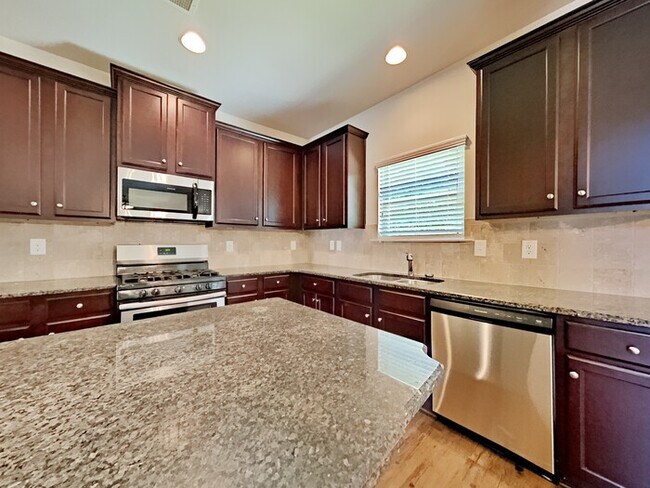 Building Photo - Available Now! Lovely 4 Bedroom Home locat...
