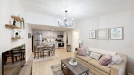 Located at 5500 St Marys Rd in Columbus, Georgia, this single-story, one-bedroom, one-bathroom unit offers a well-designed layout that maximizes functionality. The open-concept living and dining area flows seamlessly into the kitchen, creating a cohesive and welcoming space. Light wood-style flooring runs throughout, brightening the interior and lending a clean, modern aesthetic. A stylish chandelier anchors the combined living and dining zone, while a front-facing window allows natural light to fill the room.

The kitchen is equipped with stainless steel appliances, including a full-size refrigerator, electric range, and over-the-range microwave. Gray shaker-style cabinetry provides ample storage, complemented by light countertops and a single-basin sink. The adjacent dining area comfortably accommodates a small table and chairs.

The bedroom is a comfortable retreat featuring light-toned walls, a window with blinds and drape panels, and a double-door closet offering generous storage. The full bathroom includes a tub/shower combination with a curtain enclosure.

A dedicated laundry room houses a full-size washer and dryer alongside a water heater, adding notable convenience. Floating wall shelves in the living area and neutral wall tones throughout contribute to a cohesive, move-in-ready feel.