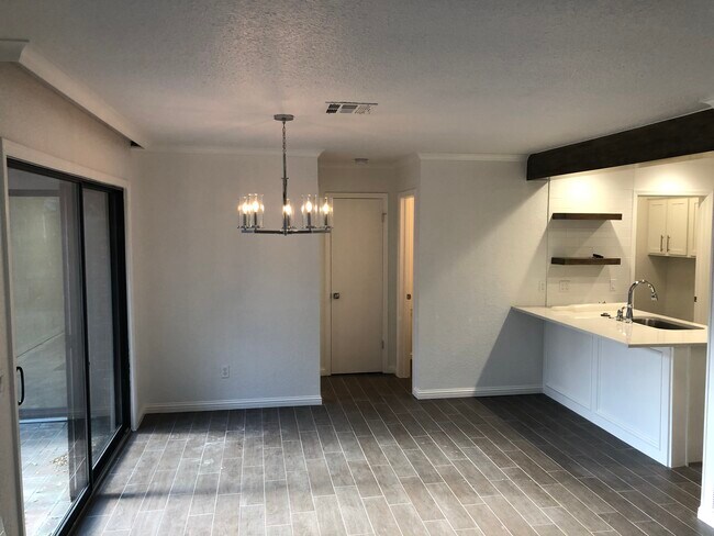 Dining area and kitchen - 9009 N May Ave