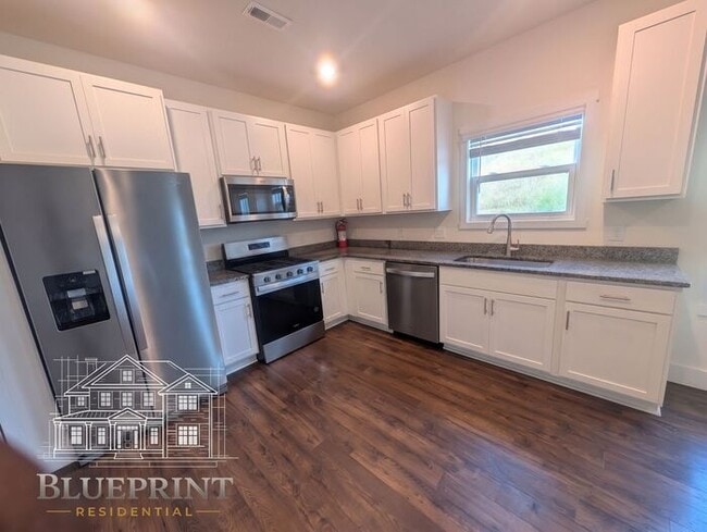 Photo - 2024 build, great neighborhood, stainless appliances, granite countertops! House
