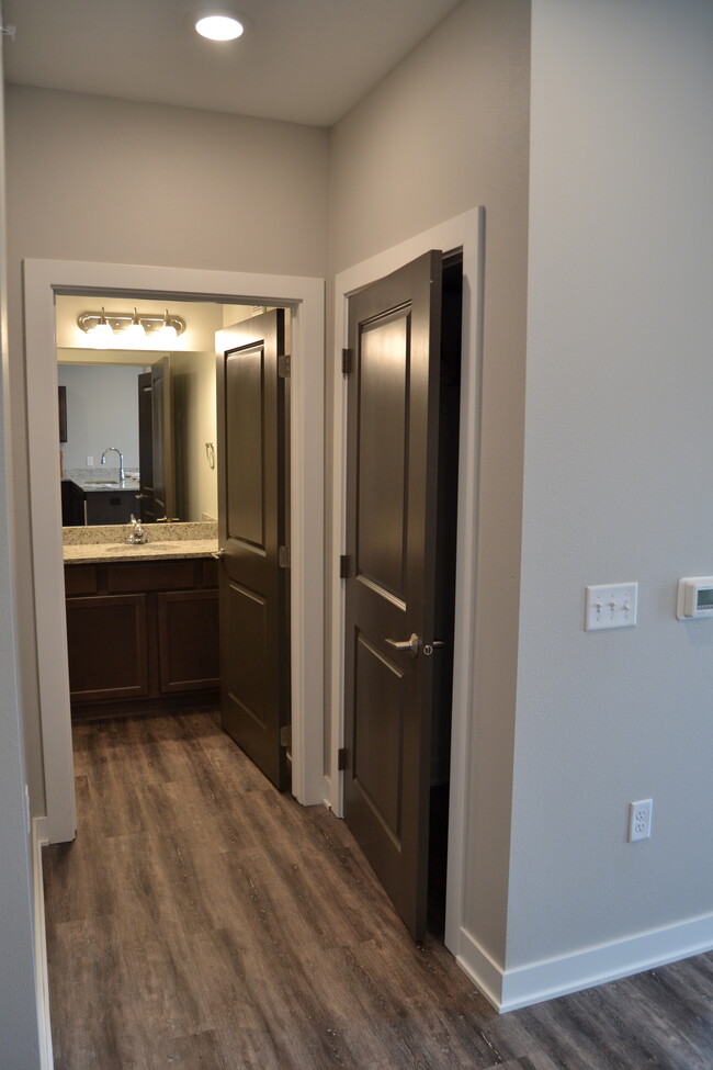 Hall Closet + Bath 1 - Perrywood Apartments