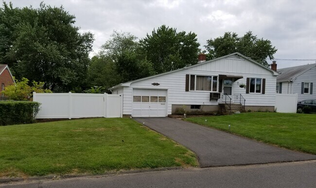 Entrance on left side of garage - 75 Stillman Rd