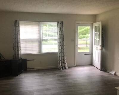 LR with brand new vinyl plank flooring - 145 Bard Dr
