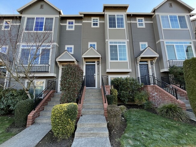 Building Photo - Bright 3-Level Townhome with Open-Concept Living, Built-In Fireplace & Modern Kitchen