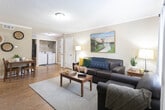 This single-story residence at 2717 Third St in Lubbock, Texas, offers a well-organized layout with a warm, neutral color palette throughout. The living room serves as the heart of the home, featuring wood-look flooring, crown molding, and a textured ceiling. Natural light filters through a front-facing window dressed with sheer curtains, creating an inviting atmosphere. The space flows openly toward a dining area, with a dedicated laundry closet housing a full-size washer and dryer conveniently nearby.

The kitchen is designed for functionality, featuring ample grey cabinetry, generous counter space, wood-look flooring, and black appliances, providing an efficient and practical cooking environment.

The home includes multiple bedrooms, each carpeted for comfort and equipped with ceiling fans. The bedrooms feature soft sage-toned walls and windows that admit natural light, contributing to a calm and restful ambiance.

Two bathrooms serve the home. The primary bath includes a dark-toned vanity with a wide mirror and tri-light fixture above, paired with tile flooring. The secondary bath features a shower-tub combination with tile flooring.

Overall, this residence presents a cohesive, comfortable design with practical features suited for everyday living in Lubbock.