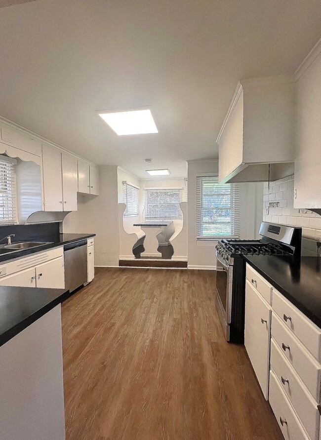 Building Photo - This 3/2/1 Nestled on Oversized Lot in Ced...