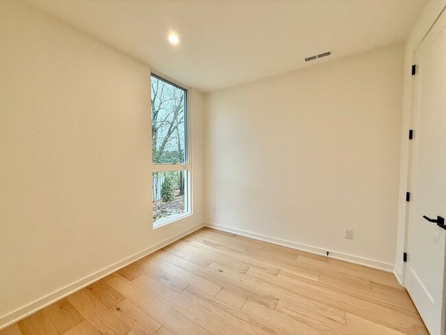 Building Photo - Luxurious New Construction 4BD, 2.5BA Raleigh Townhome with a Rooftop Terrace in a Prime Location...