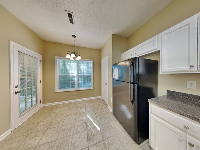 Building Photo - One Month Free! Spacious 4 Bed Home locate...