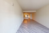 Located at 122 E Northwest Hwy in Mount Prospect, Illinois, this two-story home offers a well-organized layout across two floors, with the main level providing the majority of the living space. The open-plan main floor seamlessly connects the living area, dining room, and kitchen, all finished with light gray hardwood-style flooring and neutral cream walls that create a bright, airy atmosphere. The contemporary kitchen is a standout feature, boasting high-gloss white cabinetry extending to the ceiling, sleek quartz countertops, and stainless steel appliances including a gas range with over-the-range microwave. The bathrooms are finished to a modern standard, with one featuring a glass-enclosed walk-in shower, stone-toned countertops, and white vanity cabinetry. The three bedrooms are generously proportioned, each with light hardwood flooring and built-in closets with paneled doors. The primary bedroom includes a private en-suite bathroom. A dedicated laundry room with a full-size washer and dryer adds convenience. The home also includes a spacious attached garage with a concrete floor and automatic door opener, a utility room, and ample closet storage throughout. Two staircases connect the floors, enhancing circulation within the home.