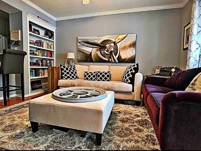 Living Room view with furniture - 6800 Glenridge Dr Townhome
