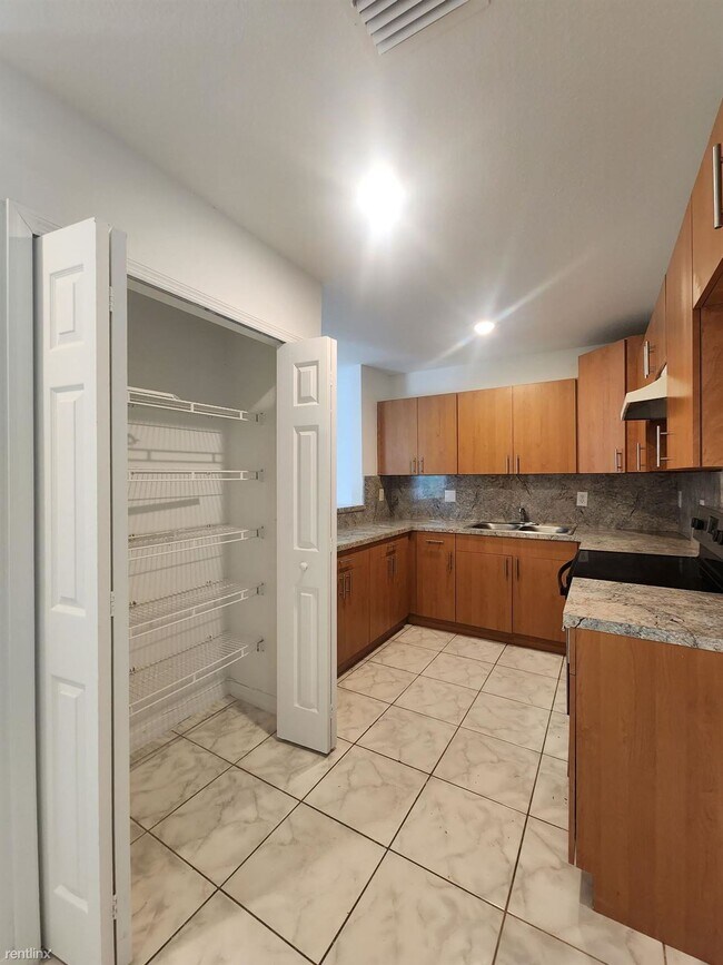 Building Photo - 4 br, 2 bath House - 7601 NW 20th Ave Exce...