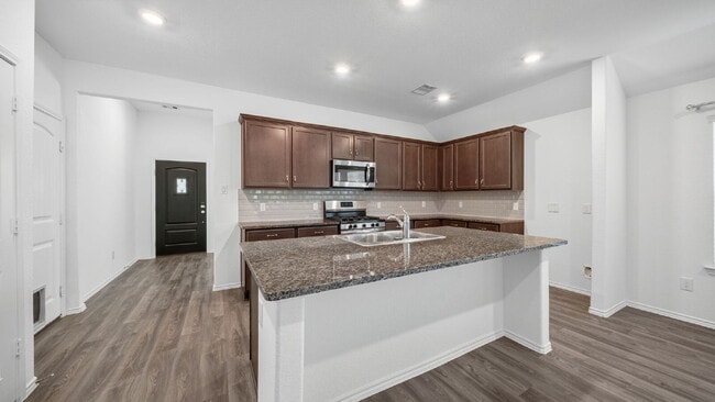 Building Photo - Welcome to this beautifully maintained one-story home offering 4 bedrooms, 2.5 bathrooms, and a s...