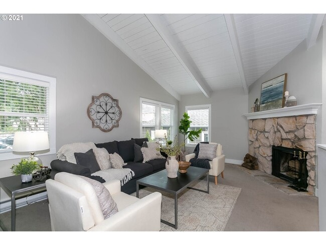 Bright and fresh Living Room with vaulted ceiling and a wood burning fireplace - 615 6th St