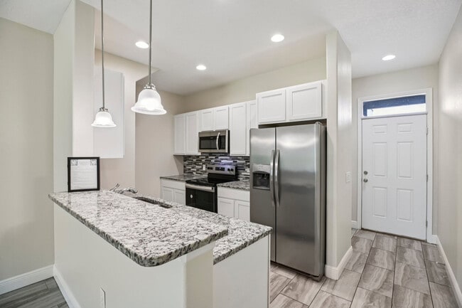 Foto del edificio - Champion Townhomes