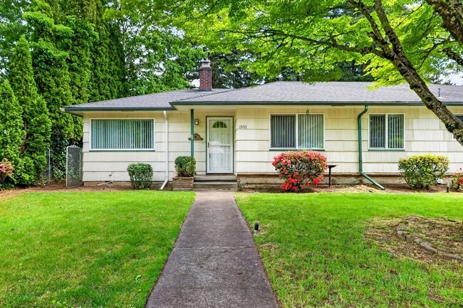 Building Photo - Charming Ranch Home with Hardwood Floors, Fireplace & Lush Curb Appeal