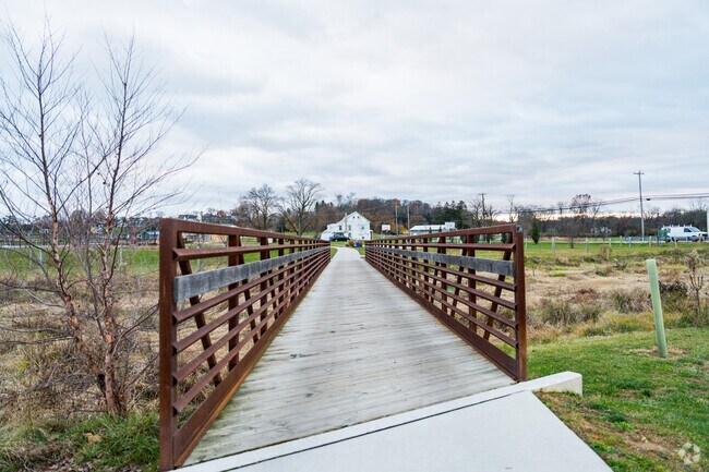 A wooden bridge leads to historic homes in Spring Grove.