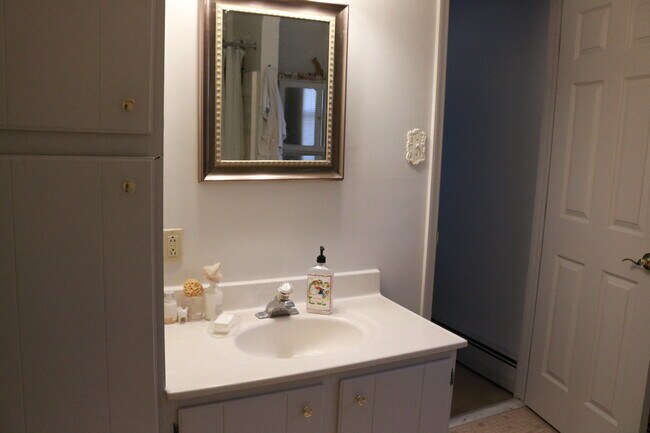 Bathroom with entrance from hallway and Bedroom - 6924 Upper York Rd