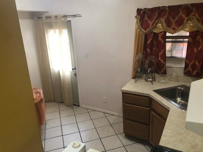 Kitchen with main private entrance and exit. - 649 Sound View Ave