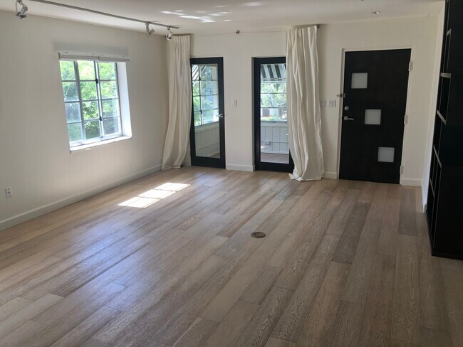 Living room looking into enclosed sunroom - 505 Columbia Dr
