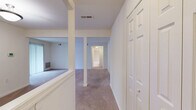 Located at 8542 Foxborough Drive in Savage, MD, this one-bedroom, one-bathroom residence offers a practical and well-organized single-floor layout. The entryway opens into a carpeted hallway with structural columns and closet access, setting a clean, neutral tone throughout. The spacious living room is a standout feature, bathed in natural light from a large sliding glass door that leads directly to a private balcony with leafy outdoor views — an ideal extension of the living space. Adjacent to the living room, the dining area flows naturally for everyday use. The kitchen is equipped with warm oak cabinetry, dark laminate countertops, a stainless steel sink, and white appliances including a refrigerator and dishwasher. Light tile flooring and a window overlooking greenery make the kitchen bright and functional. The generously sized bedroom features plush carpeting and a wide window framing tree views, offering a calm, private retreat. The full bathroom includes a tiled tub-and-shower combo, a toilet, and a wood-vanity with a clean white countertop. Additional utility space and ample closet storage round out this efficient and comfortable home.