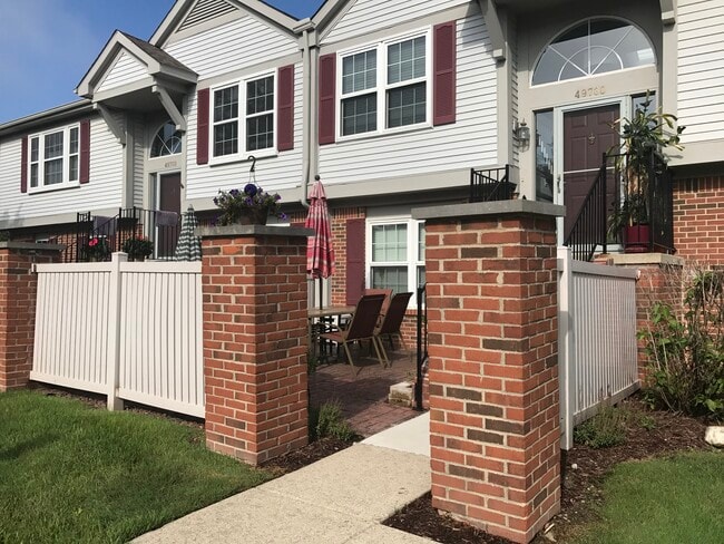 Front entrance with large brick patio - 49730 Plymouth Way