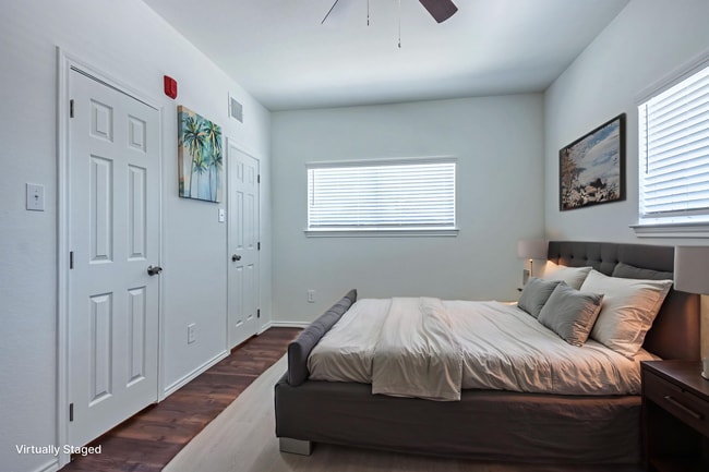 virtually staged photo of second bedroom - 11234 Park Central Pl