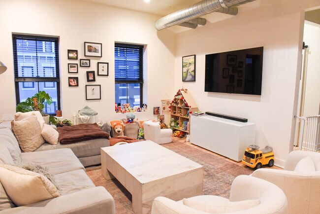 Living Room with exposed brick and 11 foot ceiling - 2017 Forbes Ave