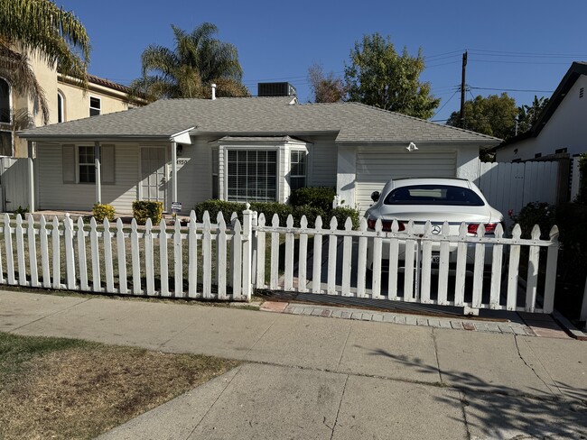 picket fence slides across driveway - 4950 Chimineas Ave