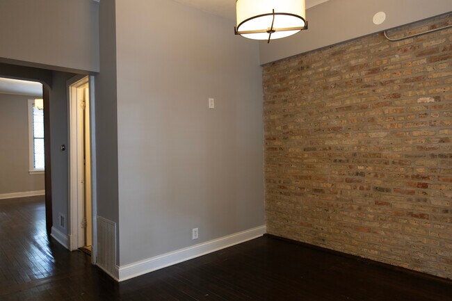 the open door next to the living/family room is the upper floor bathroom - 2246 W Charleston St