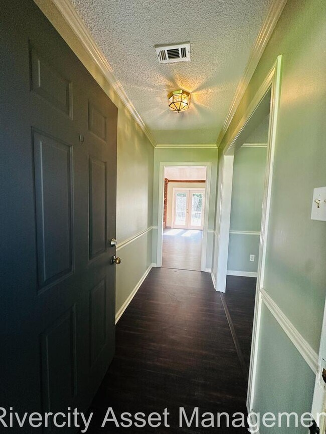 Building Photo - charming three-bedroom, two-full-bath resi...