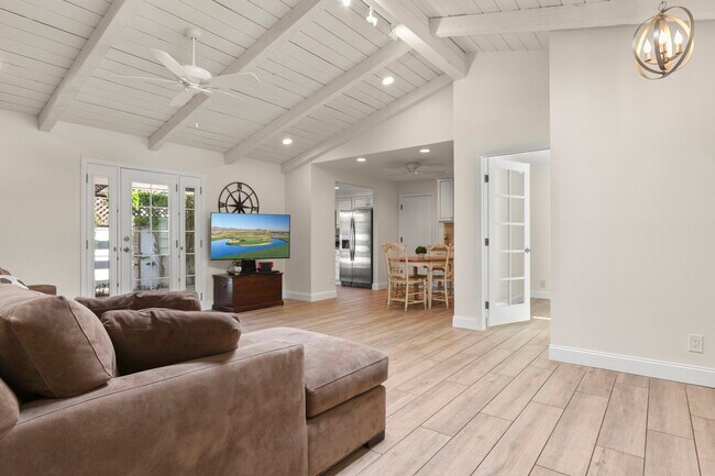Vaulted wood plank ceiling in great room adds character - 8756 E Via De La Luna