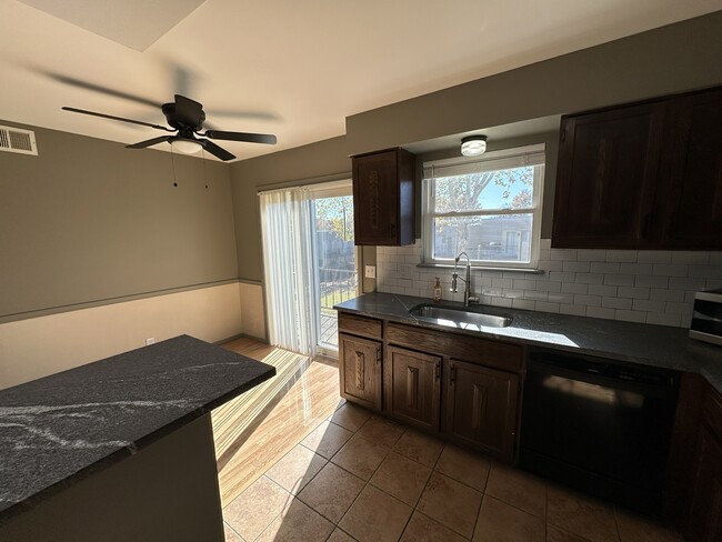 Kitchen with Breakfast Bar - 4344 E 67th St