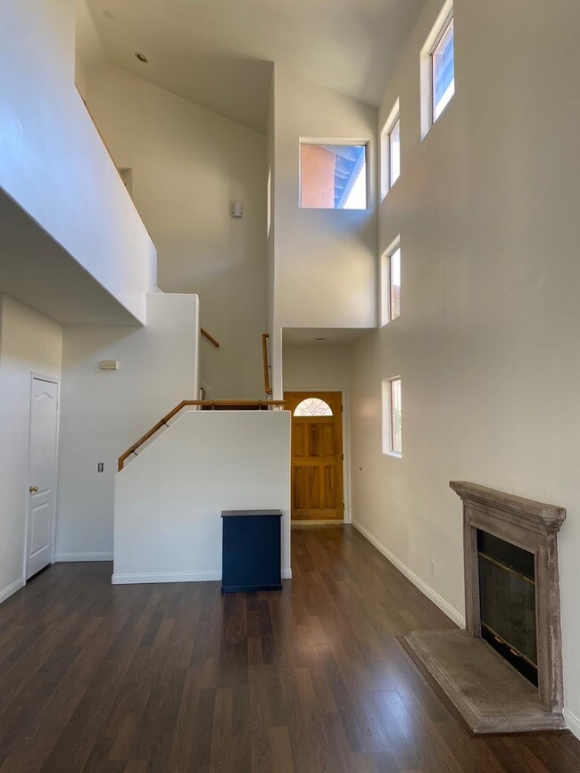 Entryway Leading to Spacious Living Area with Fireplace - 9400 Burnet Ave