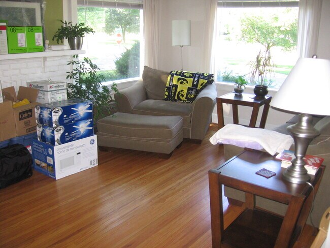 Fireplace to the left of the big chair - with lots of light from big picture windows - 2827 43rd St