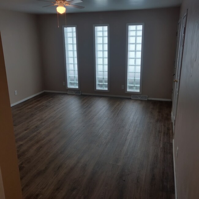 Living room with privacy glass block windows. - 3348 brown st