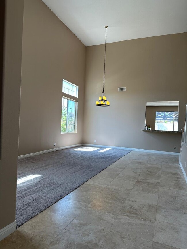 Building Photo - Available Now! Spacious 4-Bedroom Home wit...