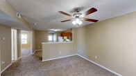 Located at 296 Muellers Cir in Statesville, NC, this single-floor, 2-bedroom, 2-bathroom home offers a practical and comfortable layout. The combined kitchen and living area forms the heart of the home, with the kitchen featuring warm oak cabinetry, ample storage, white appliances including a refrigerator and range, and easy-to-maintain tile flooring. A textured ceiling and flush-mount lighting complete the functional space.

Both bedrooms are carpeted and bathed in natural light from windows overlooking the outdoors. Ceiling fans with light kits are installed in each bedroom, enhancing comfort year-round. The primary bedroom is a well-proportioned retreat with a closet for storage, while the second bedroom also offers a double-door closet. Neutral, warm-toned walls carry throughout the home, creating a cohesive and inviting atmosphere.

The two bathrooms are finished in clean, white fixtures. One features a full soaking tub and shower combo, while the other offers a standalone walk-in shower — both with tile flooring and chrome accents. An additional utility or flex room with tile flooring provides versatility. White trim and textured ceilings are consistent throughout, giving the home a tidy, uniform appearance.