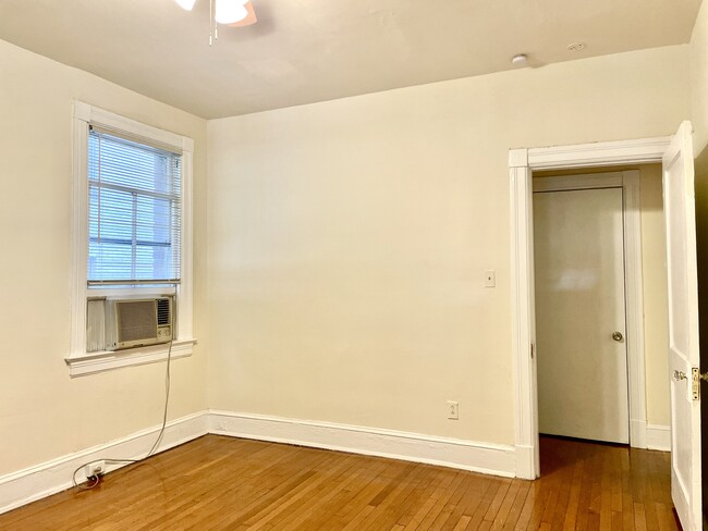 Main bedroom with ceiling fan & air conditioner - 2716 Wisconsin Ave NW