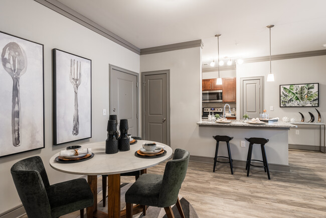 Kitchen and dining areas with hard-surface vinyl plank flooring - Avalon Perimeter Park