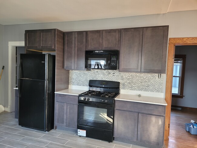 Updated kitchen with stove and refrigerator included - 13210 S Burley Ave