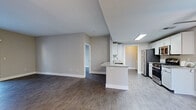Located at 701 Aspen Peak Loop in Henderson, Nevada, this single-story, three-bedroom, two-bathroom home offers a well-designed layout with modern finishes throughout. The open-concept kitchen and living area serves as the heart of the home, featuring a granite-topped island with a built-in sink, white cabinetry, stainless steel appliances including a gas range, microwave, refrigerator, and dishwasher, and wood-look flooring that extends seamlessly into the living space. Neutral-toned walls and recessed lighting create a clean, contemporary ambiance throughout.

The bedrooms are comfortably sized, with the primary bedroom offering dual windows that invite abundant natural light and a walk-in closet equipped with built-in shelving and hanging rods for ample storage. Additional bedrooms include closet space with standard hanging storage. The two bathrooms are finished with granite-top vanities, white cabinetry, and wood-look tile flooring; the primary bath features a glass-door shower enclosure.

A dedicated laundry room houses a full-size washer and dryer with an overhead storage shelf, adding everyday convenience. Wood-look flooring runs throughout most of the home, tying the spaces together with a cohesive, modern aesthetic ideal for comfortable single-floor living.