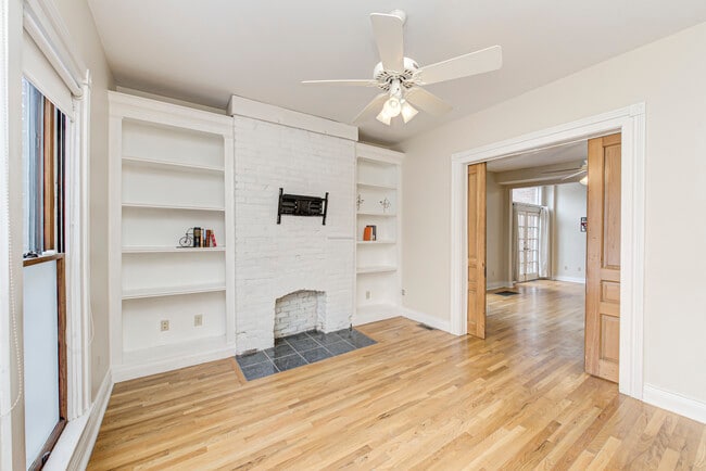 Family room with shelving and pocket doors - 237 E Saint Joseph St