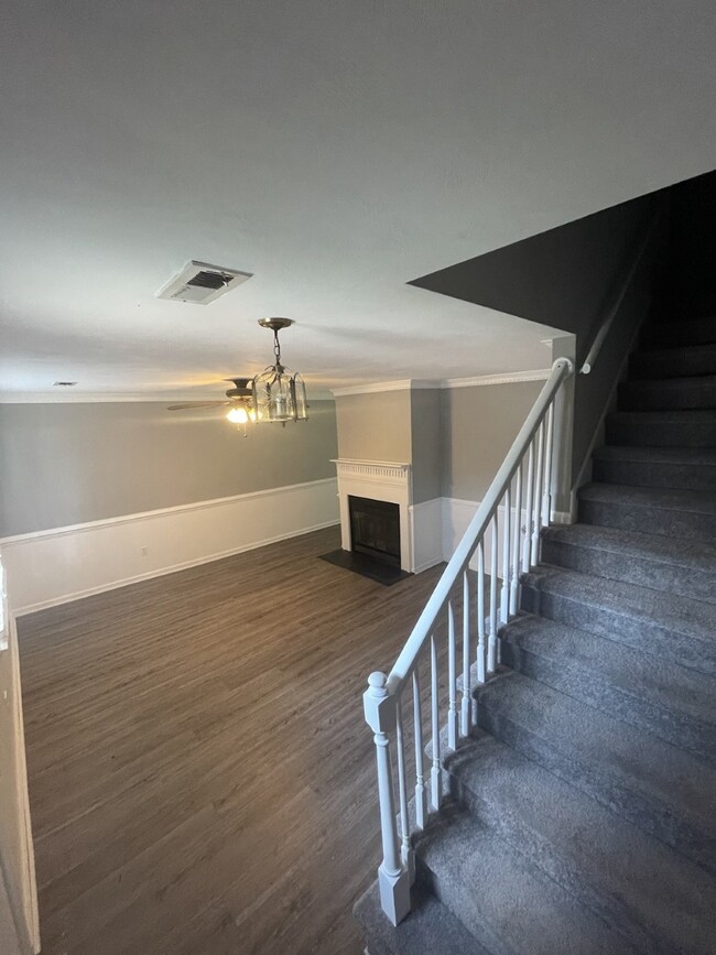 Cozy Living Room with Fire Place and storage under stairs - 730 Mill Landing Rd