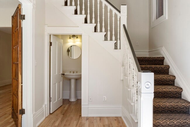 Formal entry with grand staircase and powder bath. - 3347 Tejon St
