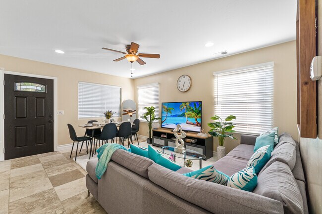 Living room bathed in natural light, creating a warm and inviting atmosphere! - 6090 Rock St